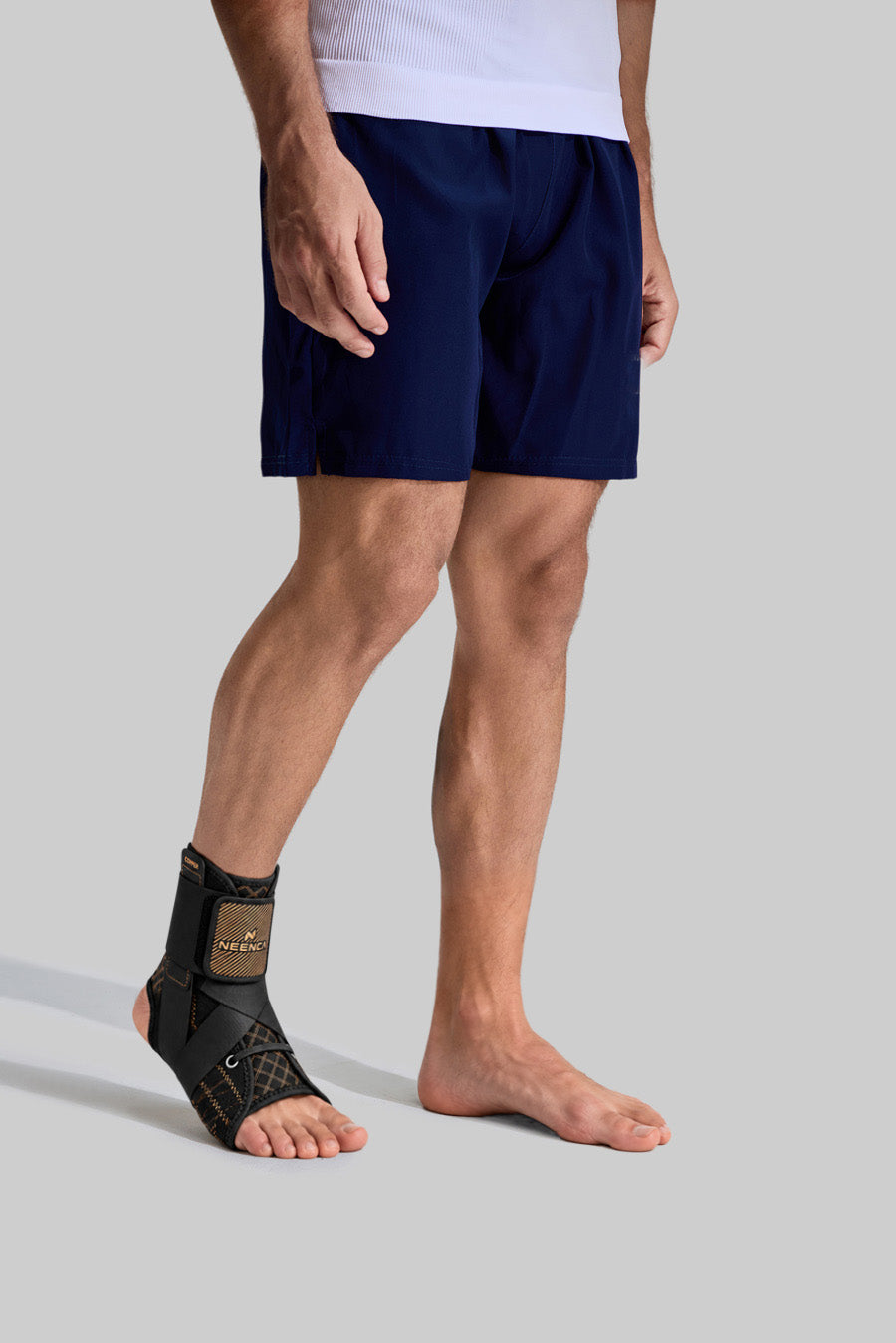 NEENCA HH004 adjustable ankle brace worn by a male model, showing the secure fit around the ankle and foot.