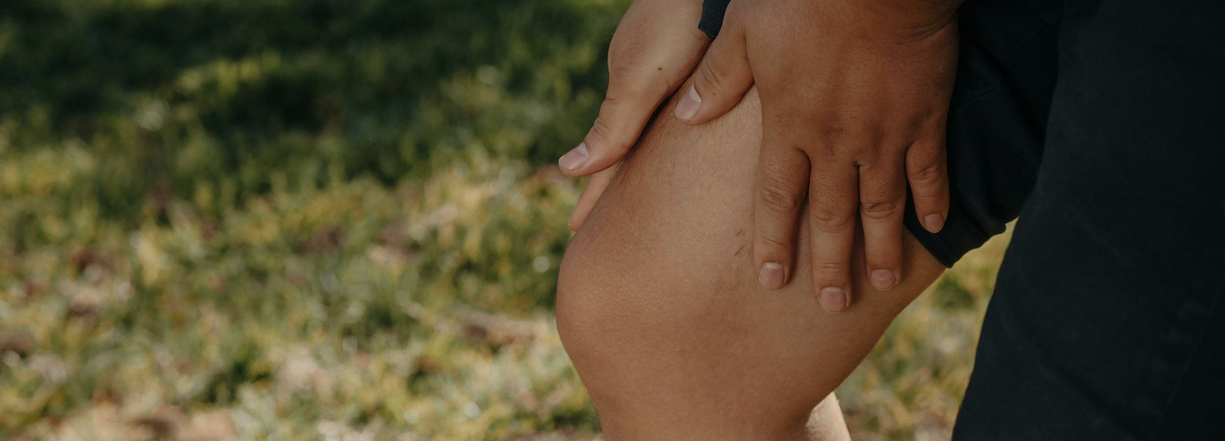 Close-up of woman massaging her painful arthritic knee, Neenca's expert joint protection advice for people with arthritis